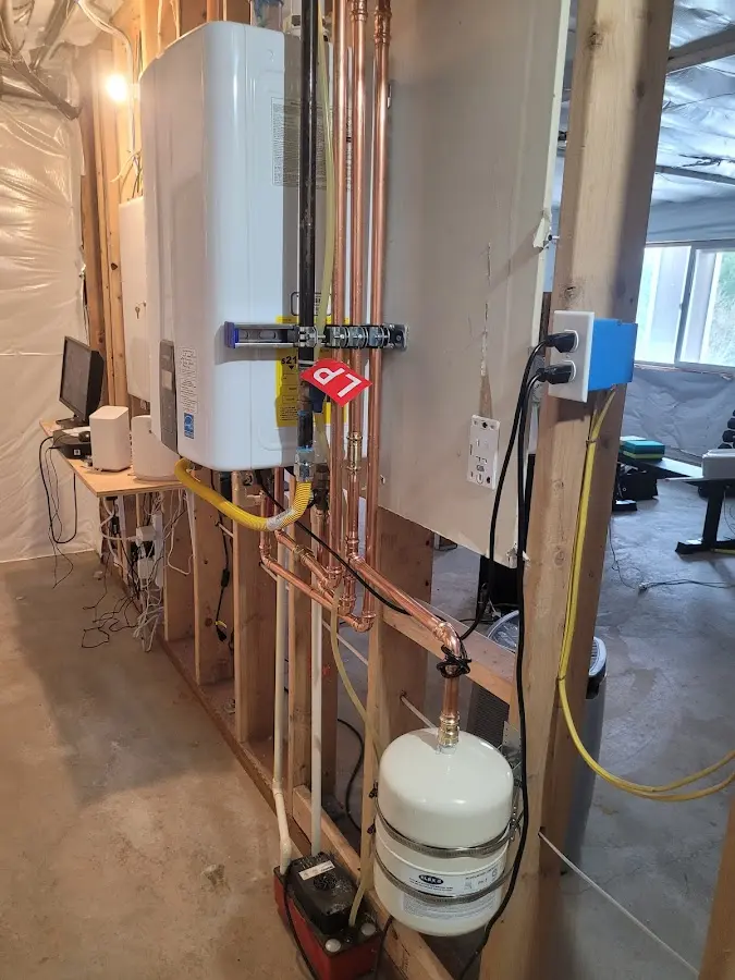 Licensed plumber repairing a kitchen sink in Four Corners